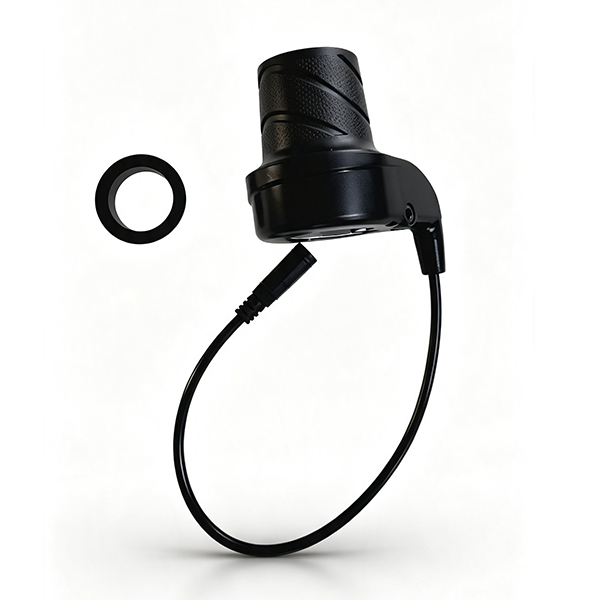 ZorixBike Throttle A black cylindrical electronic device with a textured grip, connected by a curved cable to a small black ring, shown on a clean white background.